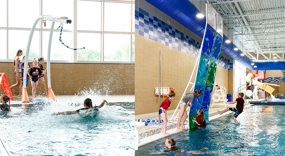 Kids lining up and splashing into the leisure pool on the zip line and kids climbing on the climbing wall